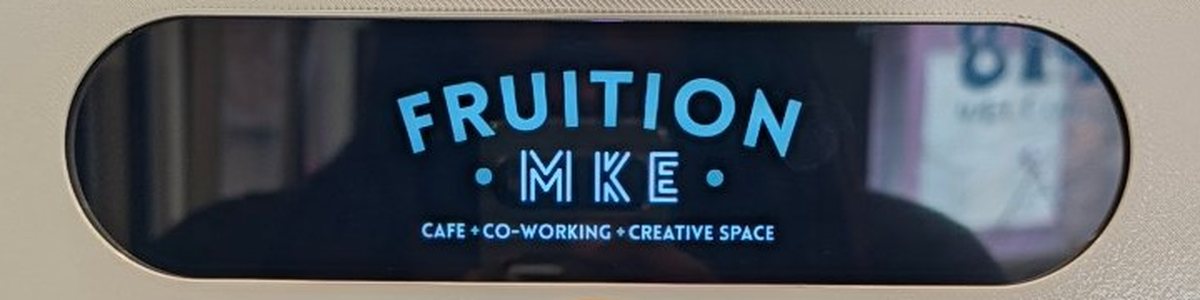 The billboard screen on the Fruition MKE Booth Mini showing the Fruition logo