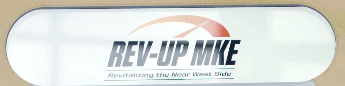 The billboard screen on a Booth Mini showing the Rev-Up MKE logo