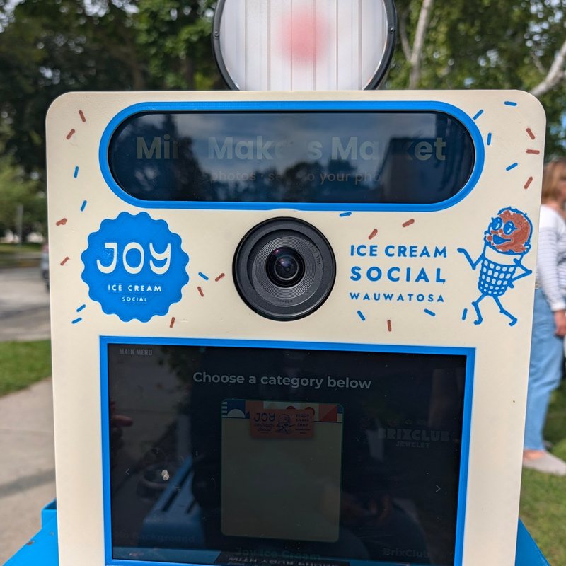 The Booth faceplate printed for Joy's Ice Cream Social with the shop's mascot and sprinkles