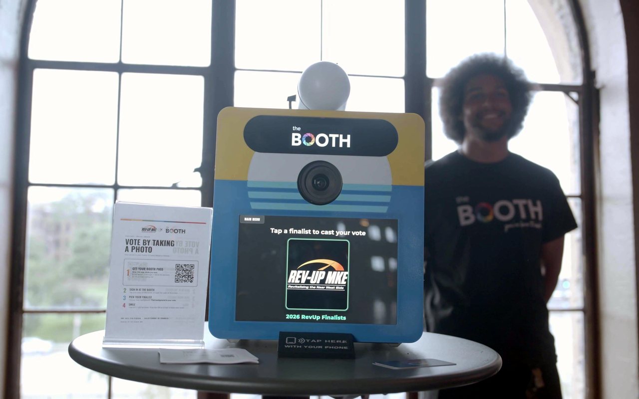 A Booth Mini on a cocktail table at Rev-Up MKE 2026, running the Audience Choice vote